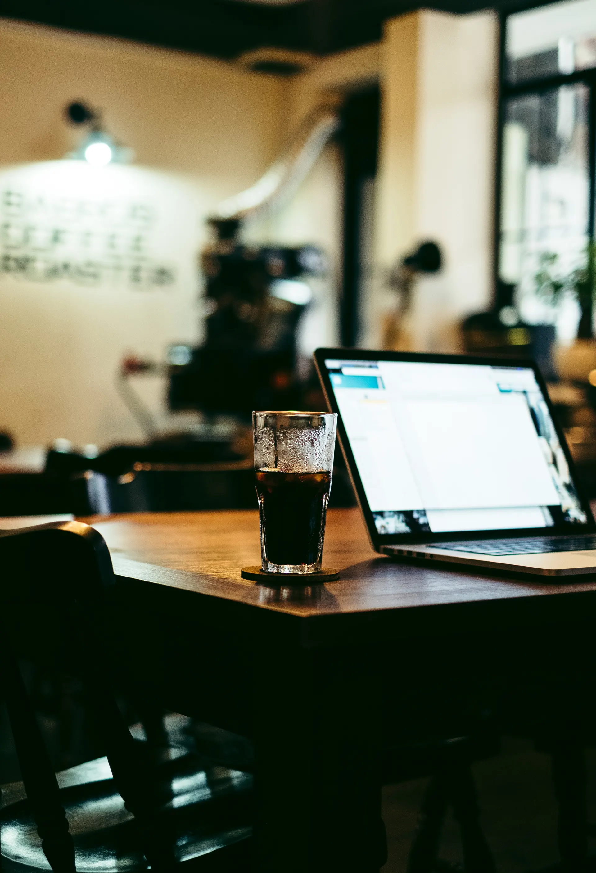 Laptop open on a café table for strategy planning